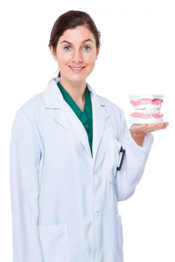 female doctor holding plastic mouth